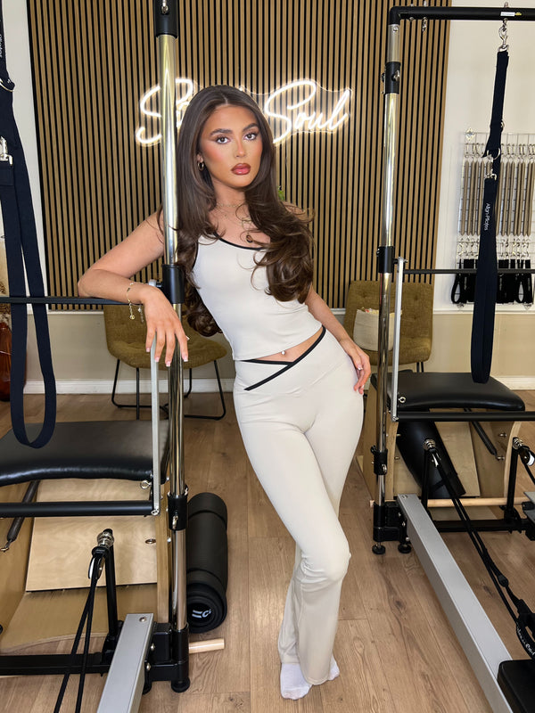 Beige Piped Edge Gym Set gym set, side view in modern Pilates studio
