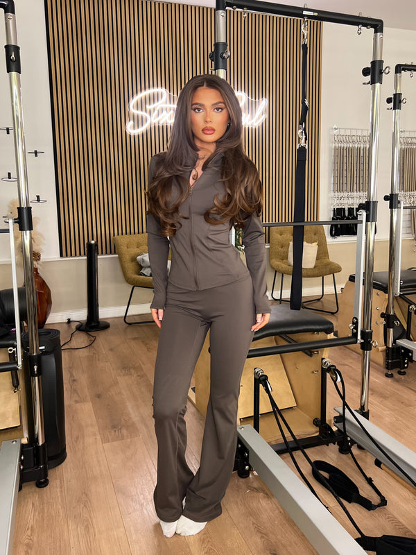 Chocolate Zip Jacket & Wide Leg Trouser Gym Set women's athleisure set, front view in Pilates studio