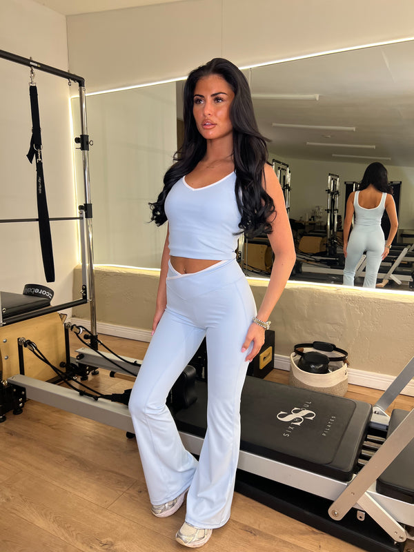 Baby Blue Piped Edge Gym Set gym set, side view in modern Pilates studio