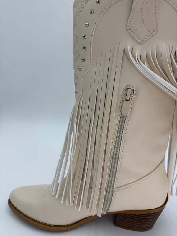 Beige fringe boot on a white background