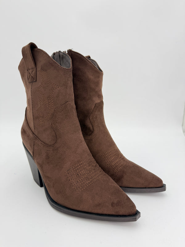 Brown suede ankle cowboy boot with a block heel on a white background