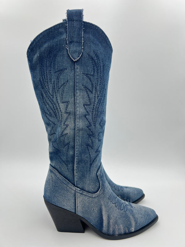 Blue denim cowboy boot on a white background