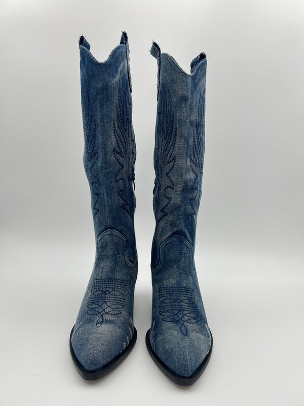 Pair of blue cowboy boots on a white background