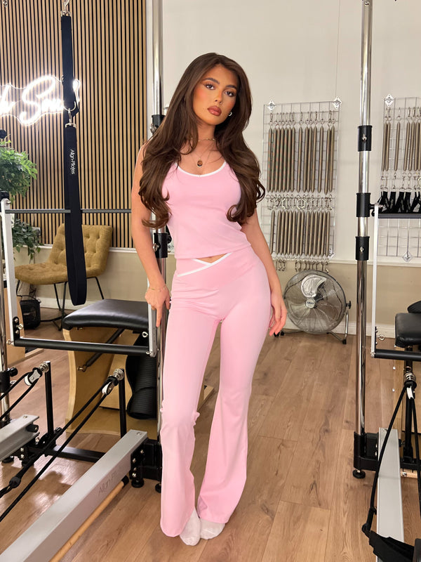 Pink Piped Edge Gym Set women's athleisure set, front view in Pilates studio