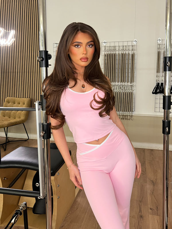 Pink Piped Edge Gym Set athleisure outfit, angled studio view