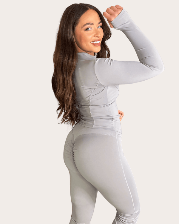 Light Grey Zip Jacket Wide Leg Trouser Gym Set activewear set, lifestyle Pilates studio setting